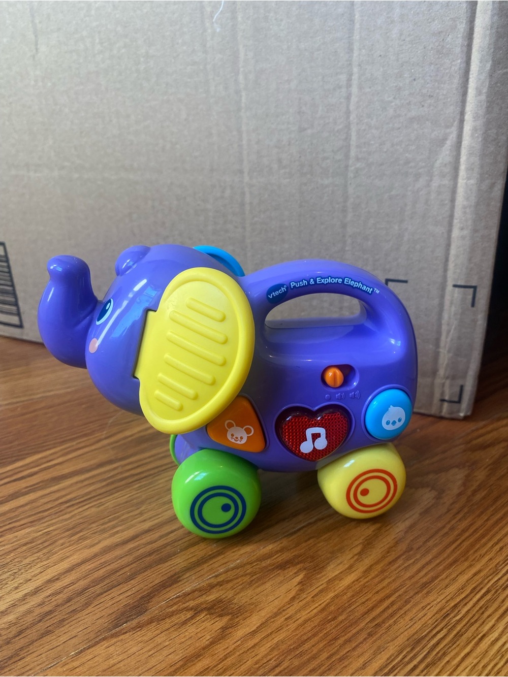Purple Push-Along Elephant Toy with Yellow Ears and Colorful Wheels